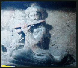 Woman with flute from tomb at Yong Li